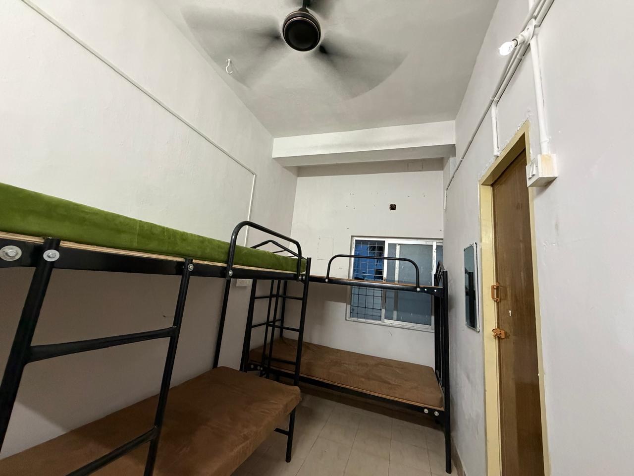 Bunk beds with fresh mattresses in the four sharing room